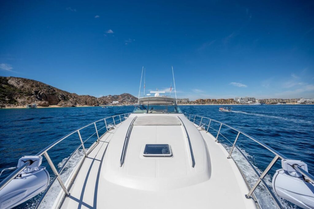 Luxury yacht 69 ft bow and Cabo shoreline