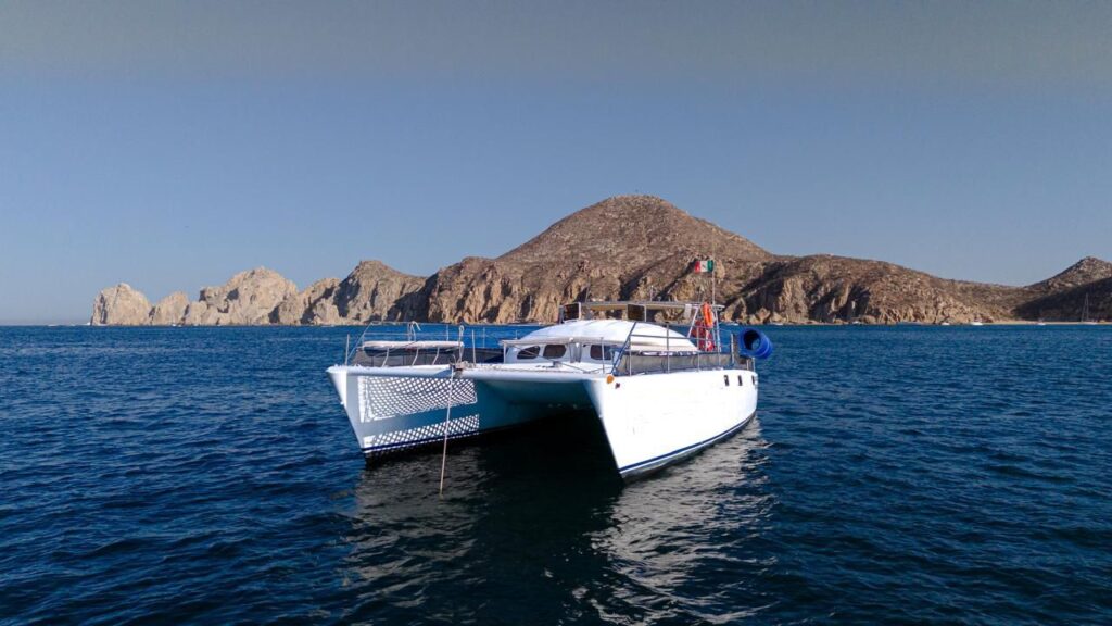 Private catamaran anchored near El Arco